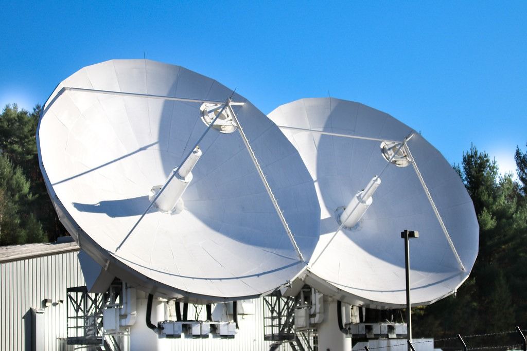 Satellite dishes against a clear sky