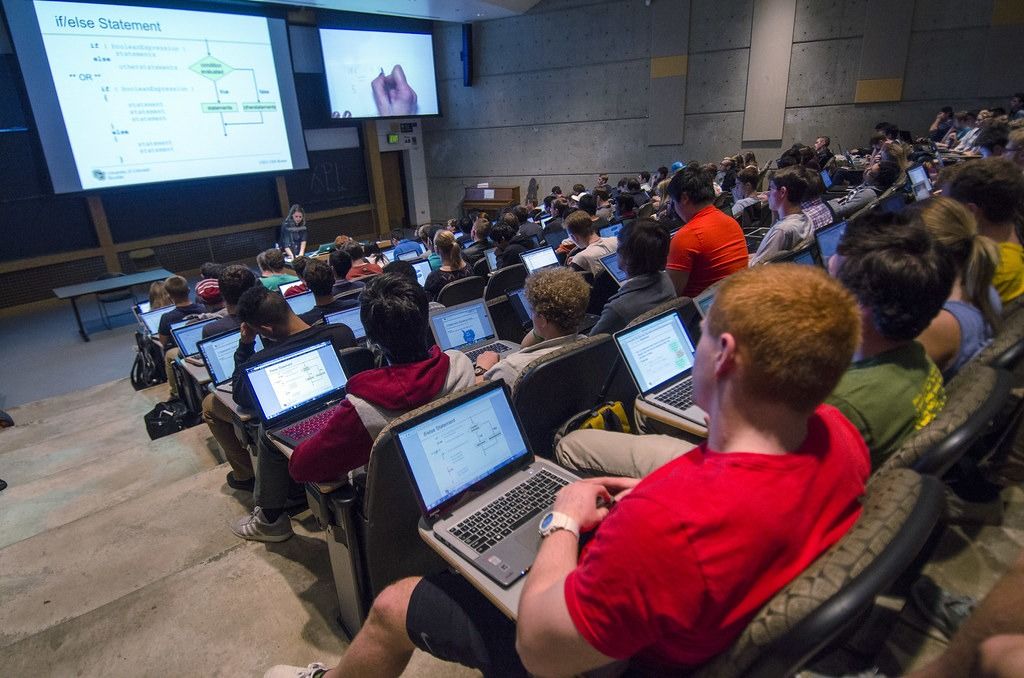 Trainees with laptops in a lecture room